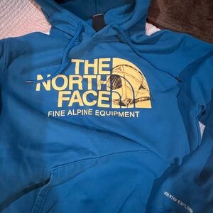 The North Face Teal Hoodie with Yellow Logo